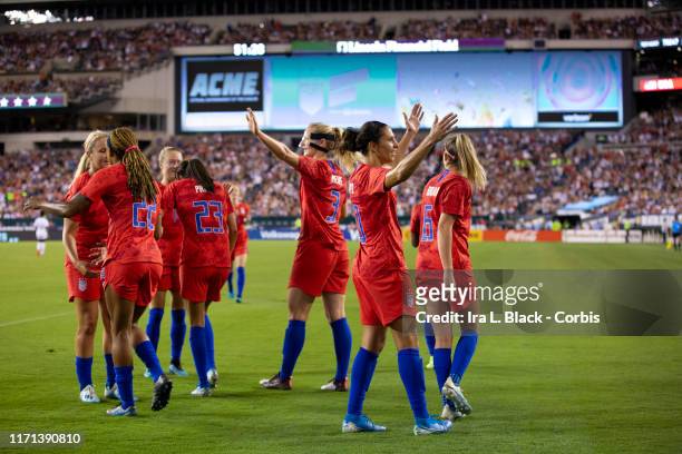 Carli Lloyd of United States of the U.S. Women's 2019 FIFA World Cup Championship waves to fans and celebrates soaring a goal with teammates in the...