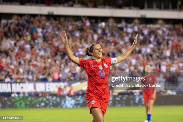 Carli Lloyd of United States of the U.S. Women's 2019 FIFA World Cup Championship flaps her arms like an Eagle as she celebrates soaring a goal in...