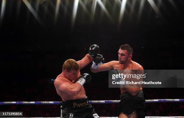 Hughie Fury punches Alexander Povetkin during the WBA International Heavyweight Title contest between Hughie Fury and Alexander Povetkin at The O2...