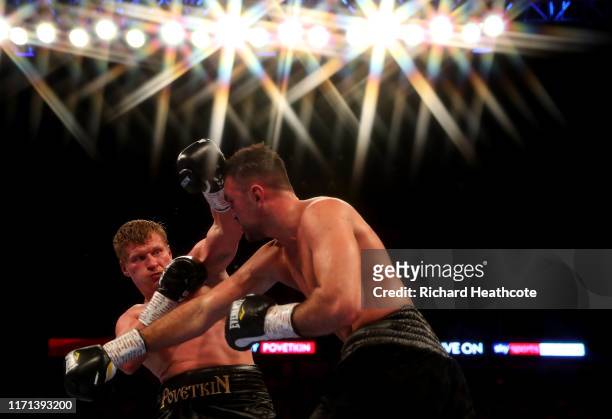 Hughie Fury punches Alexander Povetkin during the WBA International Heavyweight Title contest between Hughie Fury and Alexander Povetkin at The O2...