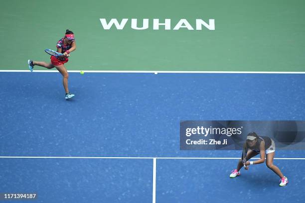 Makoto Ninomiya of Japan and Zhaoxuan Yang of China react during the Ladies Doubles semifinal against Yingying Duan of China and Veronika Kudermetova...