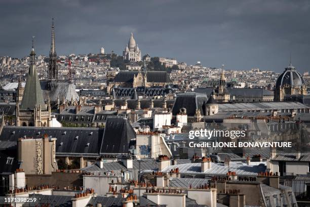 This photograph taken on September 27 shows a general view across roofs to The Basilica of the Sacre Coeur in Paris.