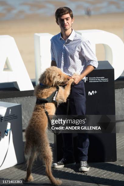 Spanish actor Biel Montoro poses with the dog Oveja during the photocall of the film "Diecisiete / Seventeen" during the 67th San Sebastian Film...