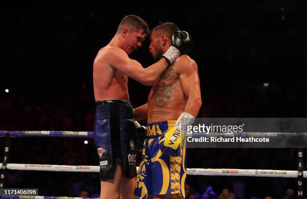 Luke Campbell amd Vasily Lomachenko embrace at the end of their fight during the WBA, WBO, WBC Lightweight World Title contest between Vasily...