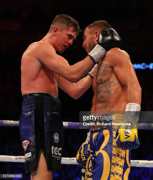 Luke Campbell amd Vasily Lomachenko embrace at the end of their fight during the WBA, WBO, WBC Lightweight World Title contest between Vasily...