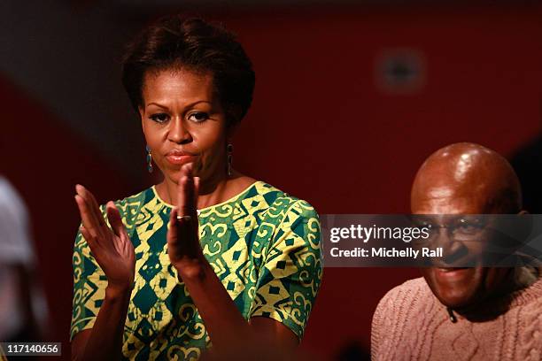 Michelle Obama, first lady of the United States of America stands next to Nobel Prize Peace Laureate, Archbishop Desmond Tutu, as they attend a Youth...