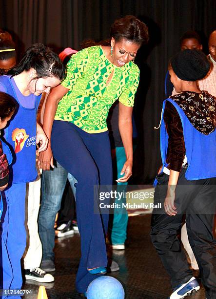 Michelle Obama, first lady of the United States of America plays with children at a Youth Soccer Event where she spoke about HIV/AIDS prevention as...
