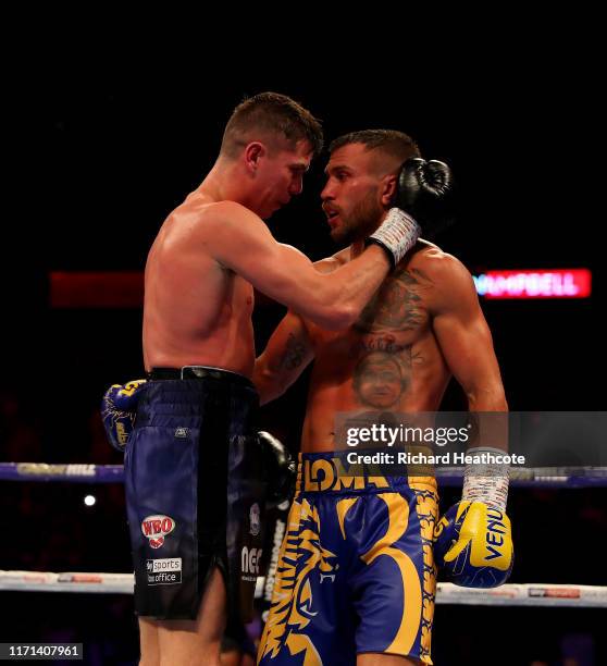 Luke Campbell amd Vasily Lomachenko embrace at the end of their fight during the WBA, WBO, WBC Lightweight World Title contest between Vasily...