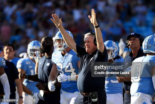 Head coach Mack Brown of the North Carolina Tar Heels reacts after his team scores against the South Carolina Gamecocks during the Belk College...