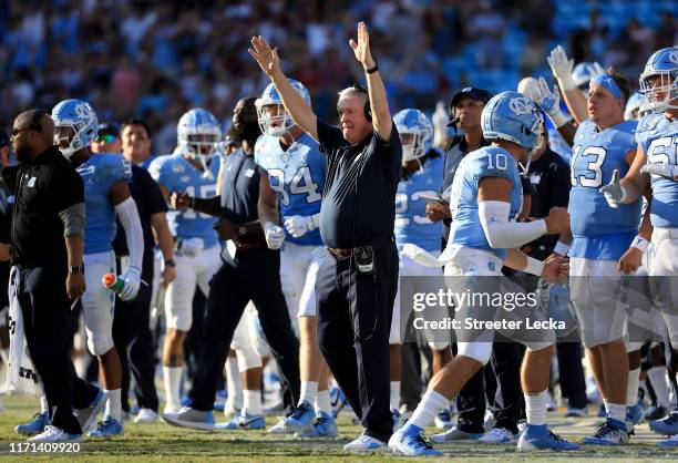 Head coach Mack Brown of the North Carolina Tar Heels reacts after his team scores against the South Carolina Gamecocks during the Belk College...