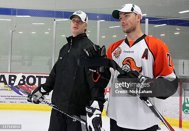 Top draft prospect Seth Ambroz talks with Adam Larsson during the American Development Model Clinic as part of the 2011 NHL Entry Draft at Saint...