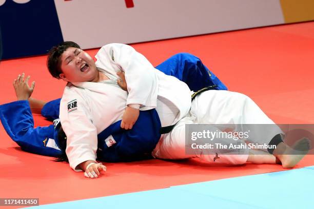 Sara Asahina of Japan throws Maria Suelen Altheman of Brazil to win in the Women's +78kg bronze medal bout on day seven of the World Judo...