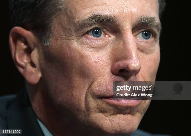 Gen. David Petraeus listens during his confirmation hearing before the Senate Intelligence Committee June 23, 2011 on Capitol Hill in Washington, DC....