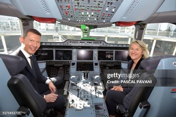 The President and CEO of Air France Benjamin Smith and Chief Executive Officer Air France Anne Rigail visit the cockpit during the ceremony for the...