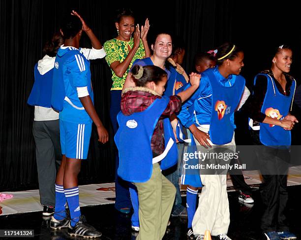 Michelle Obama, first lady of the United States of America celebrates with children at a Youth Soccer Event where she spoke about HIV/AIDS prevention...