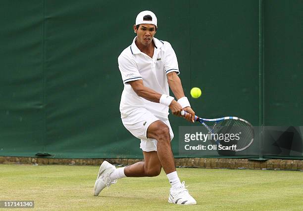 Somdev Devvarman of India returns a shot during his second round match against Mikhail Youzhny of Russia on Day Four of the Wimbledon Lawn Tennis...