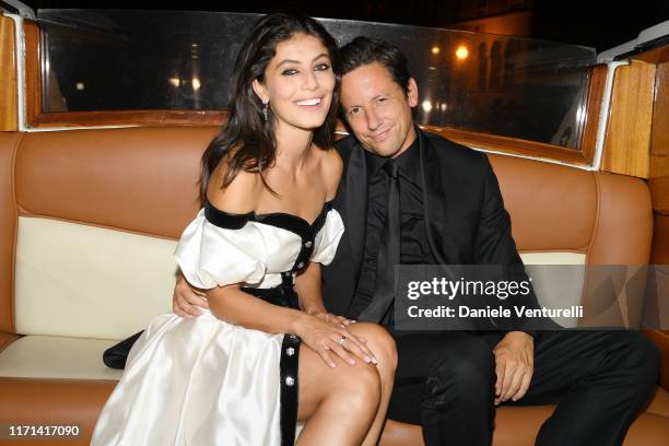 Alessandra Mastronardi and Ross McCall arrive by taxi boat to the Vanity Fair "Black And White" Ball Photocall during the 76th Venice Film Festival...