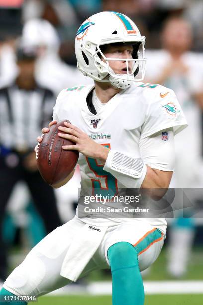Jake Rudock of the Miami Dolphins looks to pass during a NFL preseason game against the New Orleans Saints at the Mercedes Benz Superdome on August...