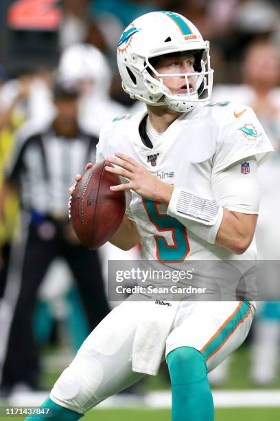 Jake Rudock of the Miami Dolphins looks to pass during a NFL preseason game against the New Orleans Saints at the Mercedes Benz Superdome on August...