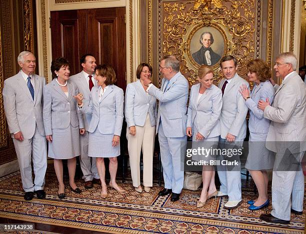 Senators wearing seersucker suits pose for a group photo in the Senate Reception Room in the Capitol on Thursday, June 23, 2011. From left are...