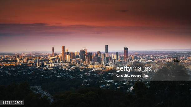 stunning sunset above brisbane cbd viewing from mount coot-tha lookout - brisbane stock pictures, royalty-free photos & images