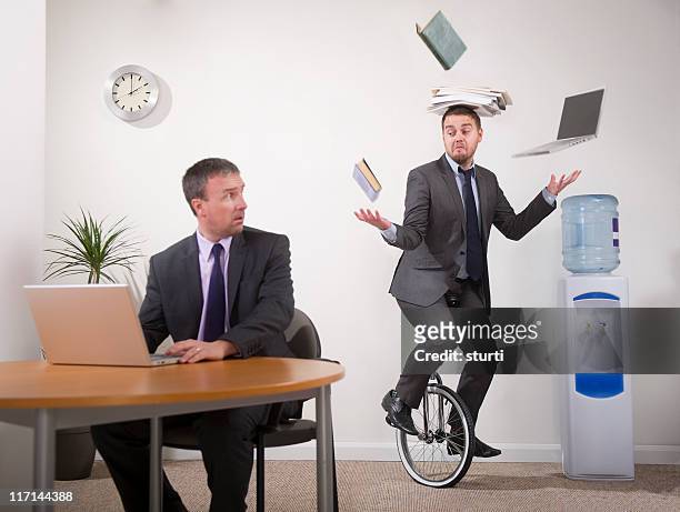 office multi-tasker - clock person desk stock pictures, royalty-free photos & images