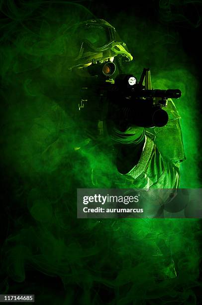 a camouflaged special forces soldier - hitman stock pictures, royalty-free photos & images