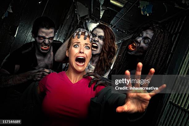 pictures of real victim struggles to get away from zombies - terrified woman stock pictures, royalty-free photos & images