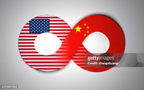 chinese and american flags are reflected on the infinity symbol - us china stock pictures, royalty-free photos & images