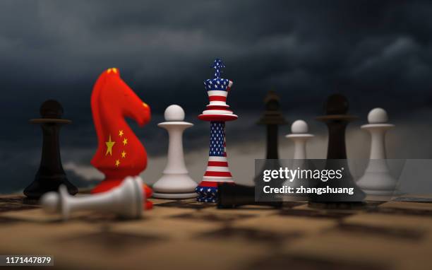 usa and china trade relations, cooperation strategy. us america and china flags on chess king on a chessboard. - punishment stocks stock-fotos und bilder