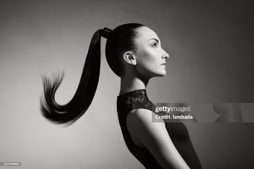 Fashion portrait of beautiful woman with ponytail