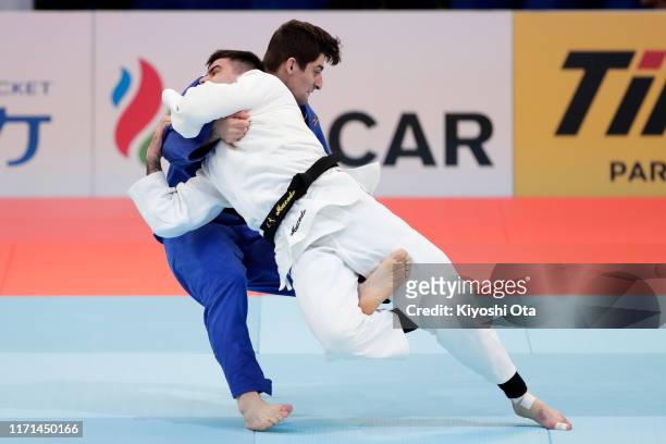 Rafael Macedo of Brazil and Eduard Trippel of Germany compete in the Men’s -90kg for the Mixed Team Competition Pool B first round between Brazil and...