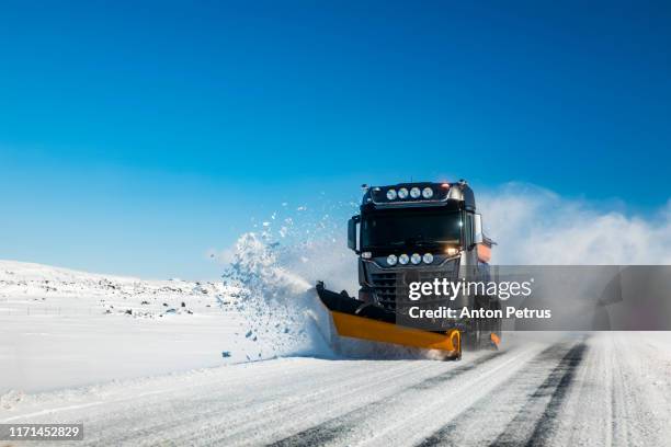 snow blower removing snow on the road after blizzard. - city of spades bildbanksfoton och bilder