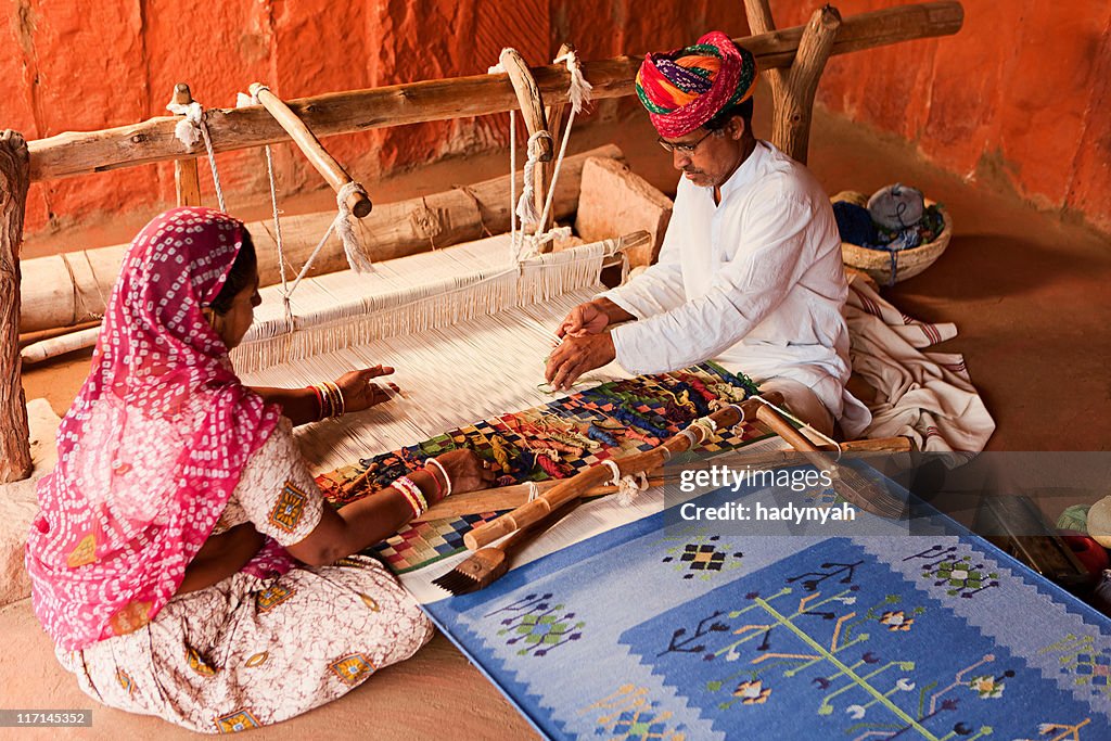 Indian couple weaving textiles (durry). Salawas village. Rajasthan.