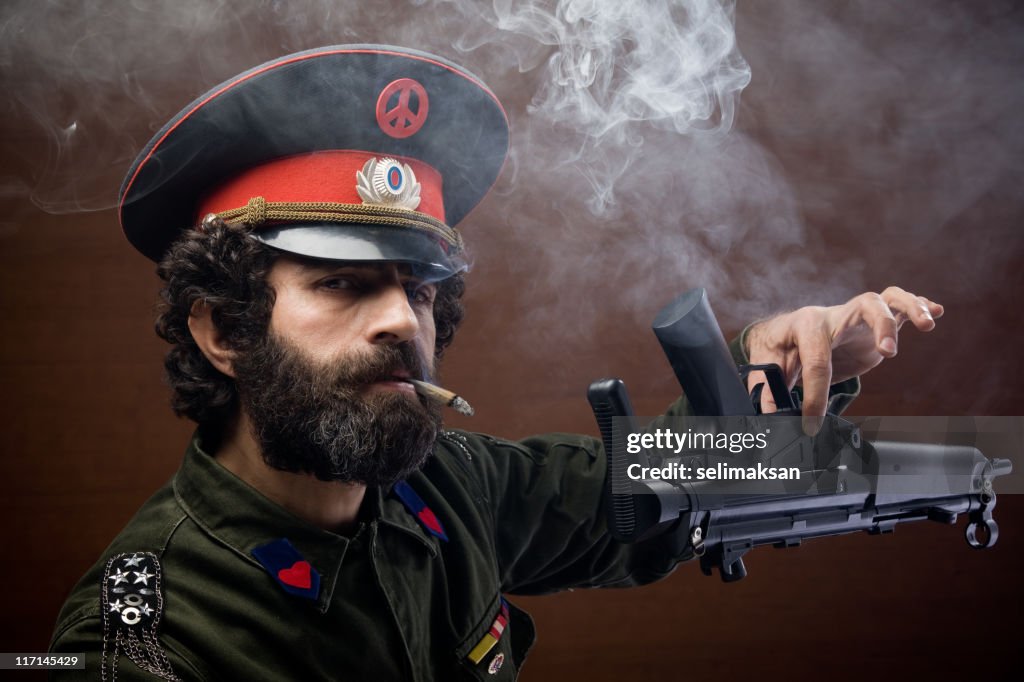 Pacifist general in military officier uniform leaving his weapon