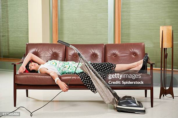 retro houswife napping - vacuum cleaner woman stock pictures, royalty-free photos & images