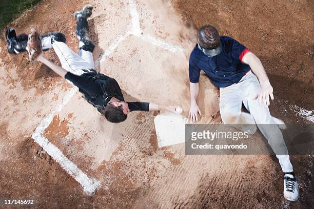 baseball player sliding into home plate, high angle, copy space - baseball catcher stock pictures, royalty-free photos & images