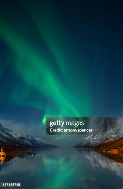 aurora borealis near tromsø, arctic norway. - tromso stock pictures, royalty-free photos & images