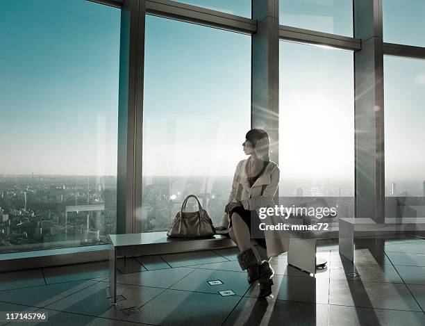 fancy woman in backlight modern architecture - tokyo fashion stock pictures, royalty-free photos & images