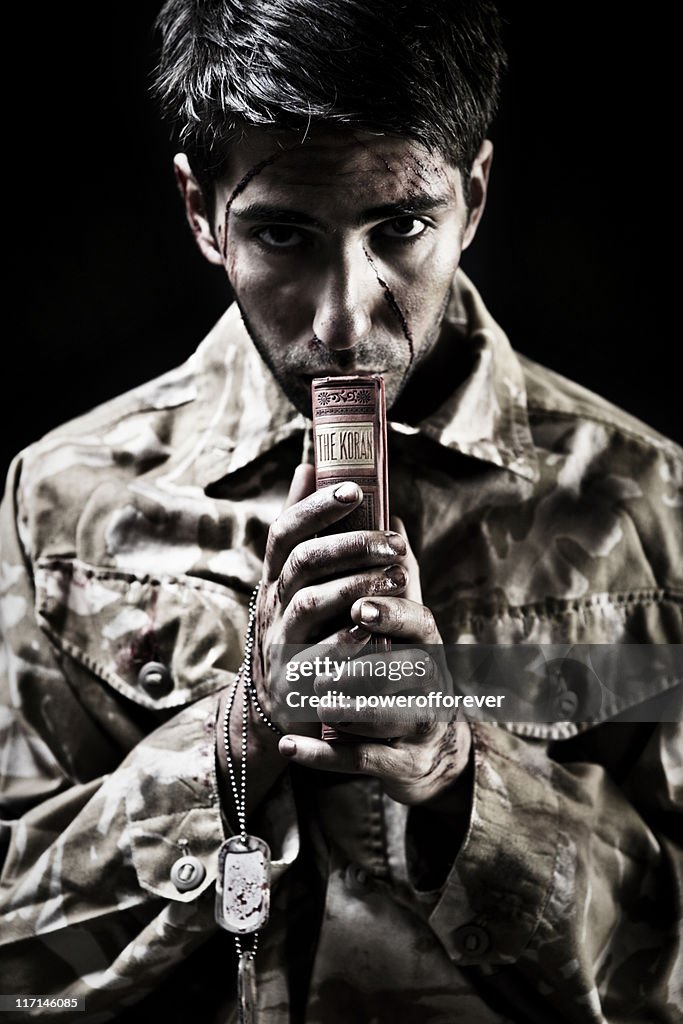 Young Afghan Soldier Clutching Koran