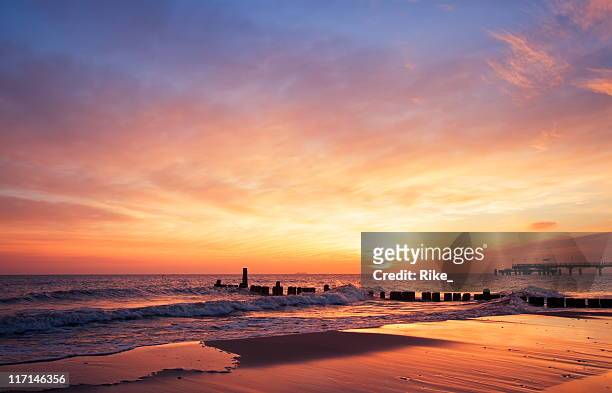the sun rising at the beach in the morning - sky stock pictures, royalty-free photos & images