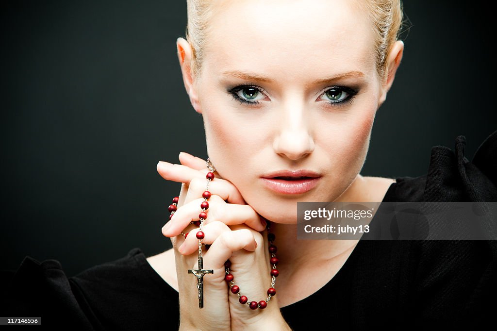 Young girl with Rosary Beads