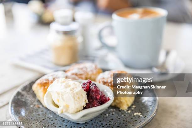 homemade scones with fresh cream & raspberry jam - アフタヌーンティー ストックフォトと画像