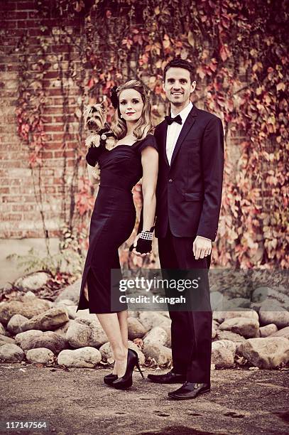 vintage woman and man with yorkshire terrier - hollywood couples stock pictures, royalty-free photos & images