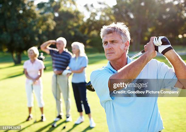 smart, mature golf fiore - woman on swing foto e immagini stock