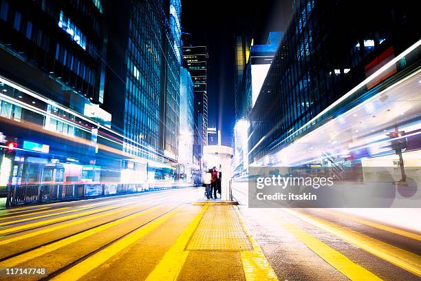 futuristic crossroad at night - city lights reflected on buildings speed stock pictures, royalty-free photos & images