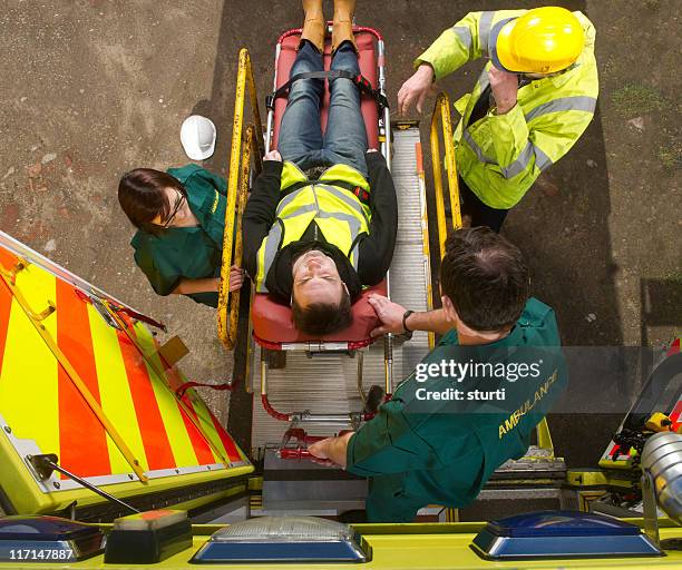 construction site accident - ambulance uk stock pictures, royalty-free photos & images