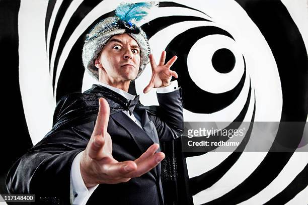 hypnotist mind control - magician stock pictures, royalty-free photos & images