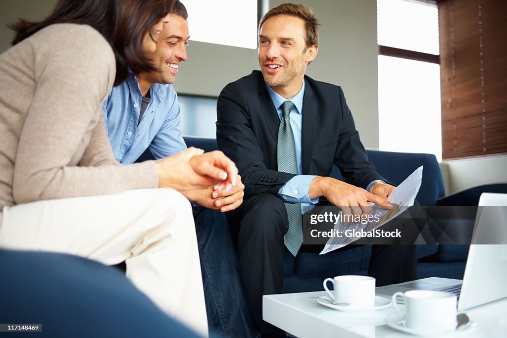 Photo of a financial planner helping a couple