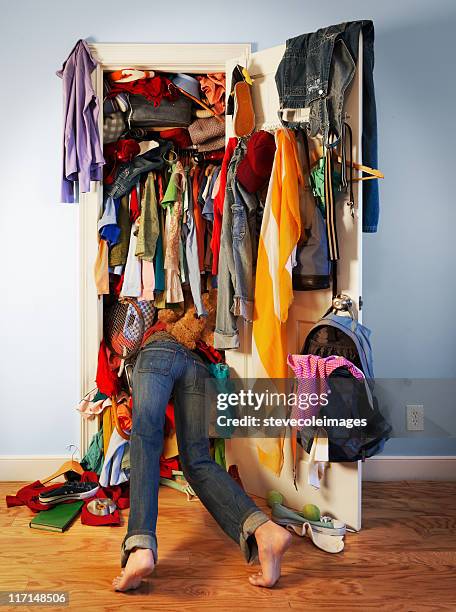 messy closet - clothes wardrobe stockfoto's en -beelden